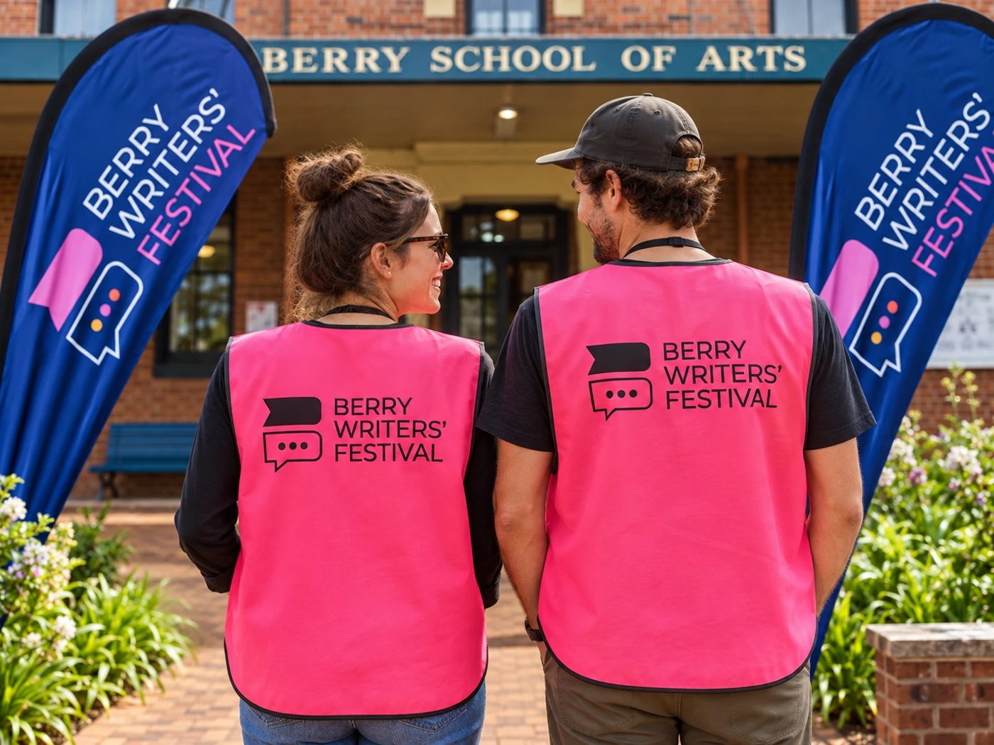 Berry Writers' Festival flags and volunteer vests outside the School of Arts